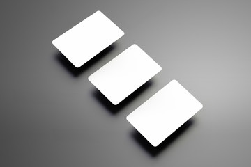 Stylish mockup of a three bank (gift) cards placed diagonally on a gray background.