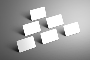 Universal  mockup of six  bank gift cards arranged in a triangle  on a gray  background.