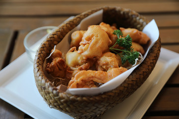 Calamari rings , fried squid on wood background , Italian food