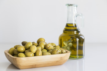 Olive oil concept with bottle and olive. Eat olive oil for a healthy life.
