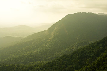 Mountainous terrain and cloudy sky