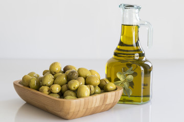 Olive oil concept with bottle and olive. Eat olive oil for a healthy life.