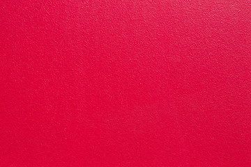 Bright color textured background, crimson red painted wall with copyspace for text or design