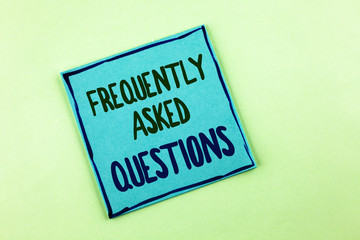 Conceptual hand writing showing Frequently Asked Questions. Business photo showcasing most common inquiries Informations Help Guide written on Sticky Note Paper on the plain background.