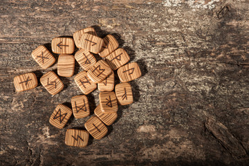 Runes on a textured old wooden surface