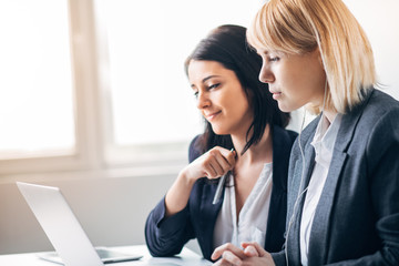 Colleagues working in office