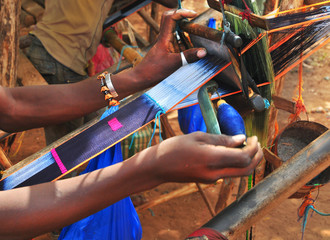 Weavers producing the traditional African fabric kente
