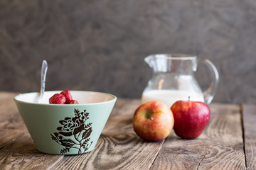 a jug of milk, apples and porridge