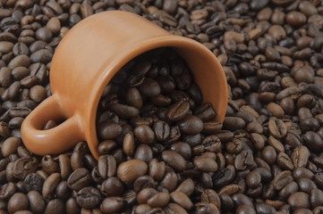 Spilled out of cup coffee beans