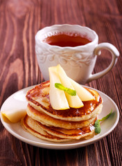 Pear and honey pancakes on plate