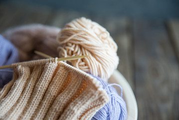 tangles with a knitting thread on a wooden table