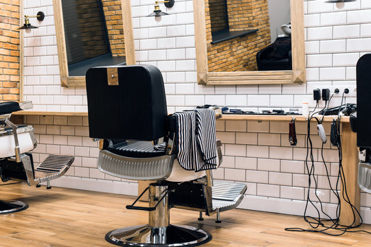 Empty barbershop with armchairs