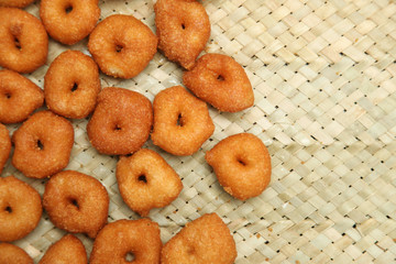 Deep frying medu vada in the pan. Medu Vada is a savoury snack from South India, very common street food in the India.