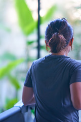 Fototapeta premium Back view of woman excercise in running track in fitness with motion blur
