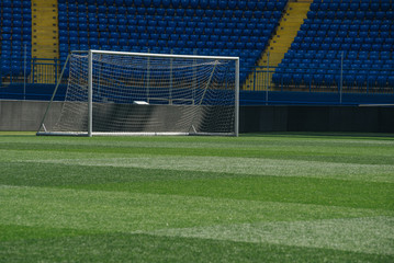 On the stadium. Soccer ball on green arena