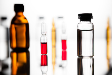 Group of ampoules with a transparent medicine in medical laboratory