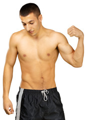 Obraz premium Topless young man bodybuilder posing isolated on white background