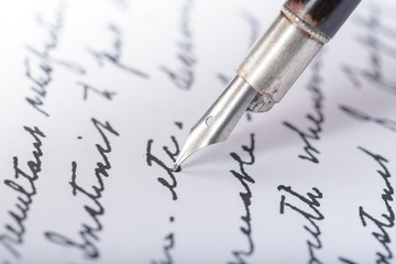 Fototapeta premium Fountain pen on an antique handwritten letter
