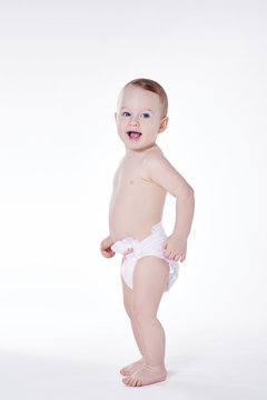 Toddler In Diaper Standing At Studio Shot