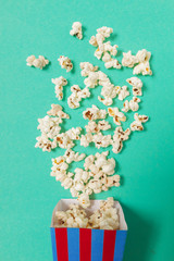 popcorn on color background