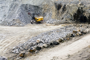 Excavator works quarrying extraction of aluminum ore. heavy machinery © SecondSide