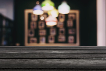 Empty wooden table and blurred background of abstract in front of restaurant or coffee shop for display of product or for montage