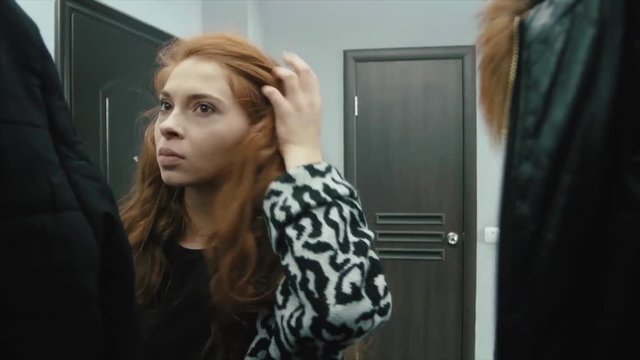 Young angry man and woman blaming each other during indoor quarrel. Married couple quarrels at home