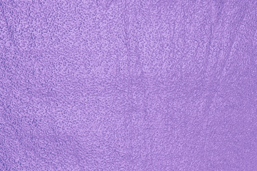 Shiny metallized purple foil textured surface for background