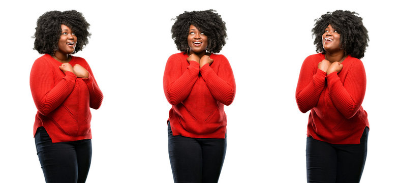 Young beautiful african plus size model happy and excited celebrating victory expressing big success, power, energy and positive emotions. Celebrates new job joyful isolated