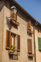 Fototapeta na wymiar windows with shutters in Orvieto, Rome suburb, Italy