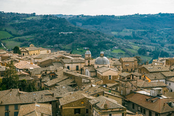 Fototapeta na wymiar aerial view of buildings and church in Orvieto, Rome suburb, Italy
