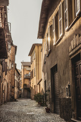 empty street and buildings with sunlight in Orvieto, Rome suburb, Italy