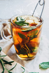 Black Hot tea with lemon and ginger on linen napkin