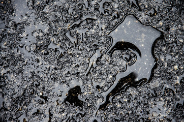 Engine oil on fresh asphalt