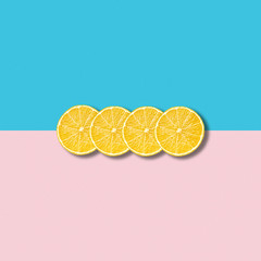 Minimal abstract illustration with group of lemon slices on pastel background