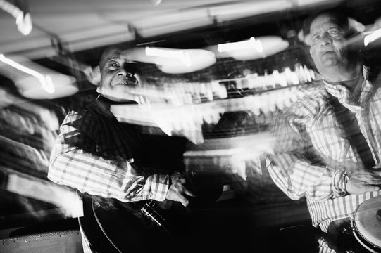 musician playing guitar in in the night club