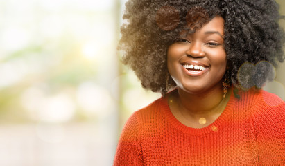 Beautiful african woman confident and happy with a big natural smile laughing, outdoor