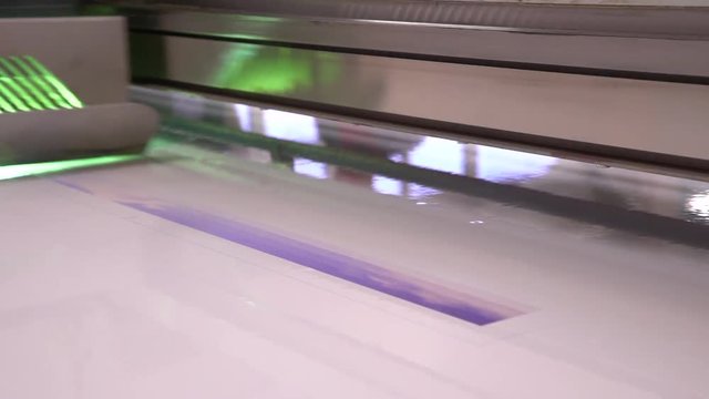UV the printer in work. Tablet UV prints the printer