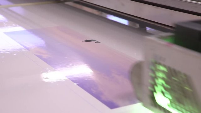 UV printer. The press on a film. The equipment works. Close up