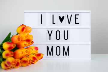 Mother's day - lightbox with words "I love You mom" on the table