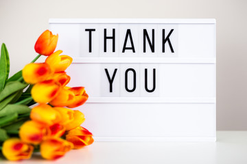 lightbox with text "Thank You" and flowers on the table
