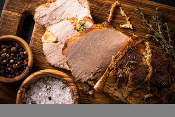 Baked pork meat with spices and herbs.  Top view.