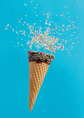 Ice cream cone with colorful sprinkles