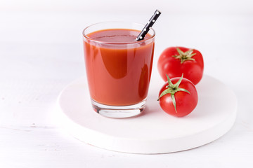 Glasses of Tasty Tomato Juice with Raw Tomatoes on White Wooden Background Healthy Diet Detox Drink