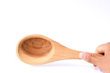 Hand holding  wooden turner, cooking time