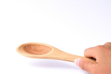 Hand holding  wooden turner, cooking time