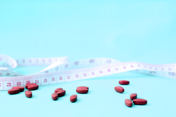 Weight loss for a limited time by taking medicine, Weight loss pills with clock and measuring tape