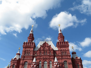 Fototapeta na wymiar Red square in Moscow, russian landmark. Building of the state historical Museum on the background of cloudy blue sky