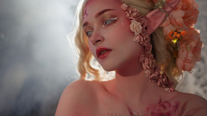 Mysterious elf girl. Creative pink makeup. Elvish ears.