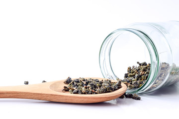 Dry tea in wooden spoons,Dry oolong tea for healthy